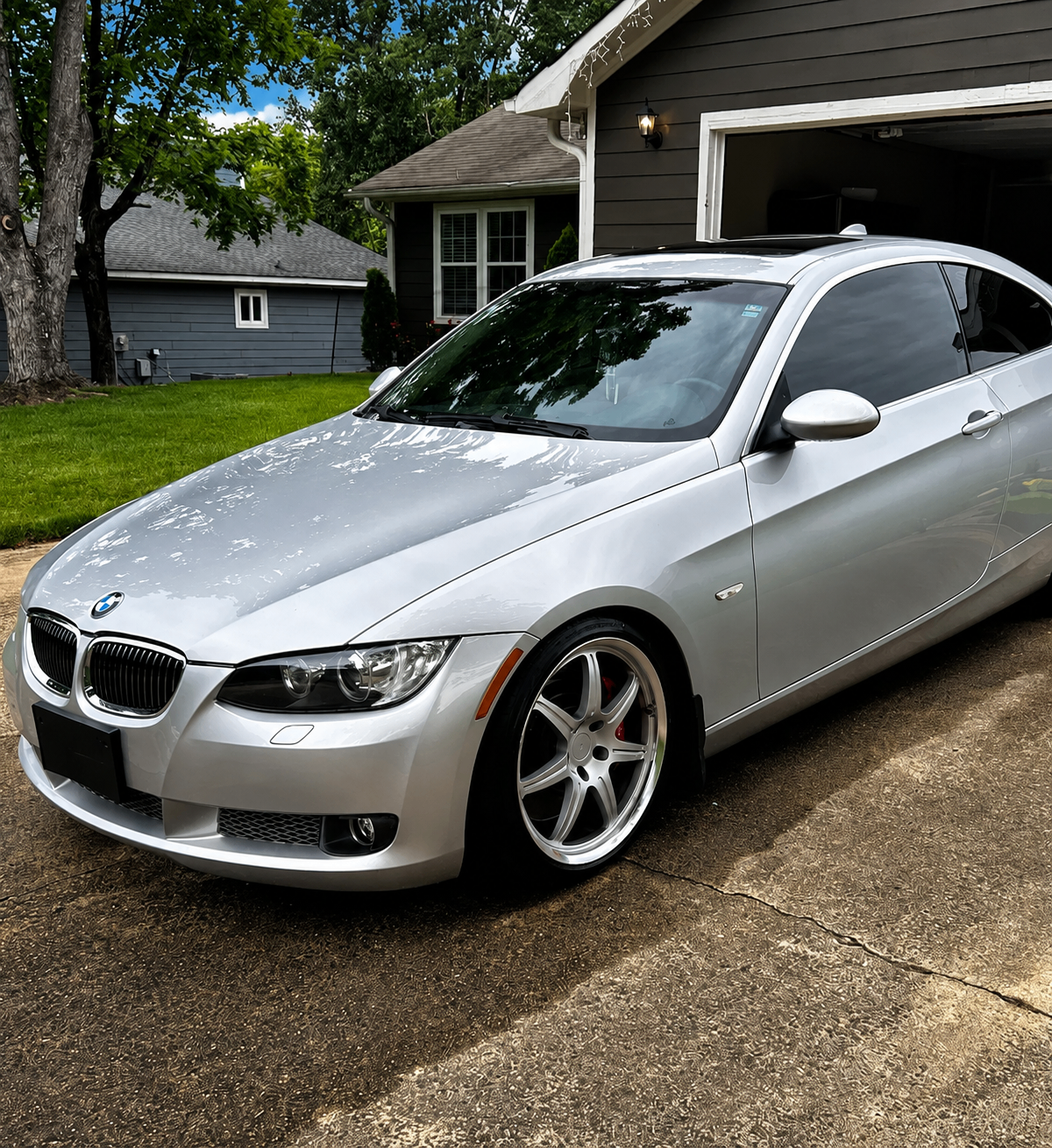 Silver BMW coupe with a freshly polished finish